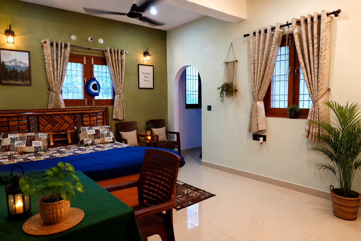 Bedroom with an arched doorway, green walls, and morning light