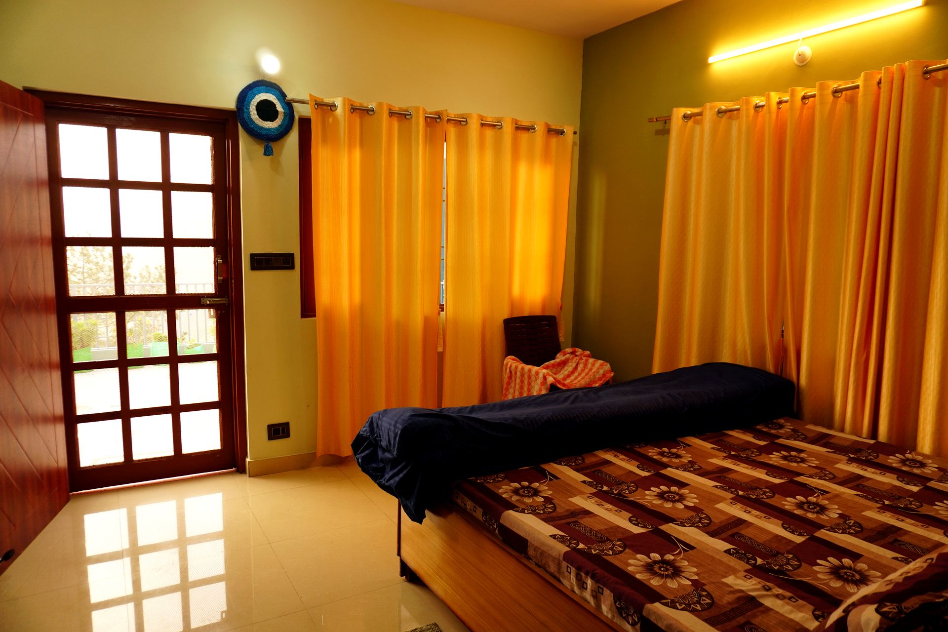 Room interior with open balcony door and daylight