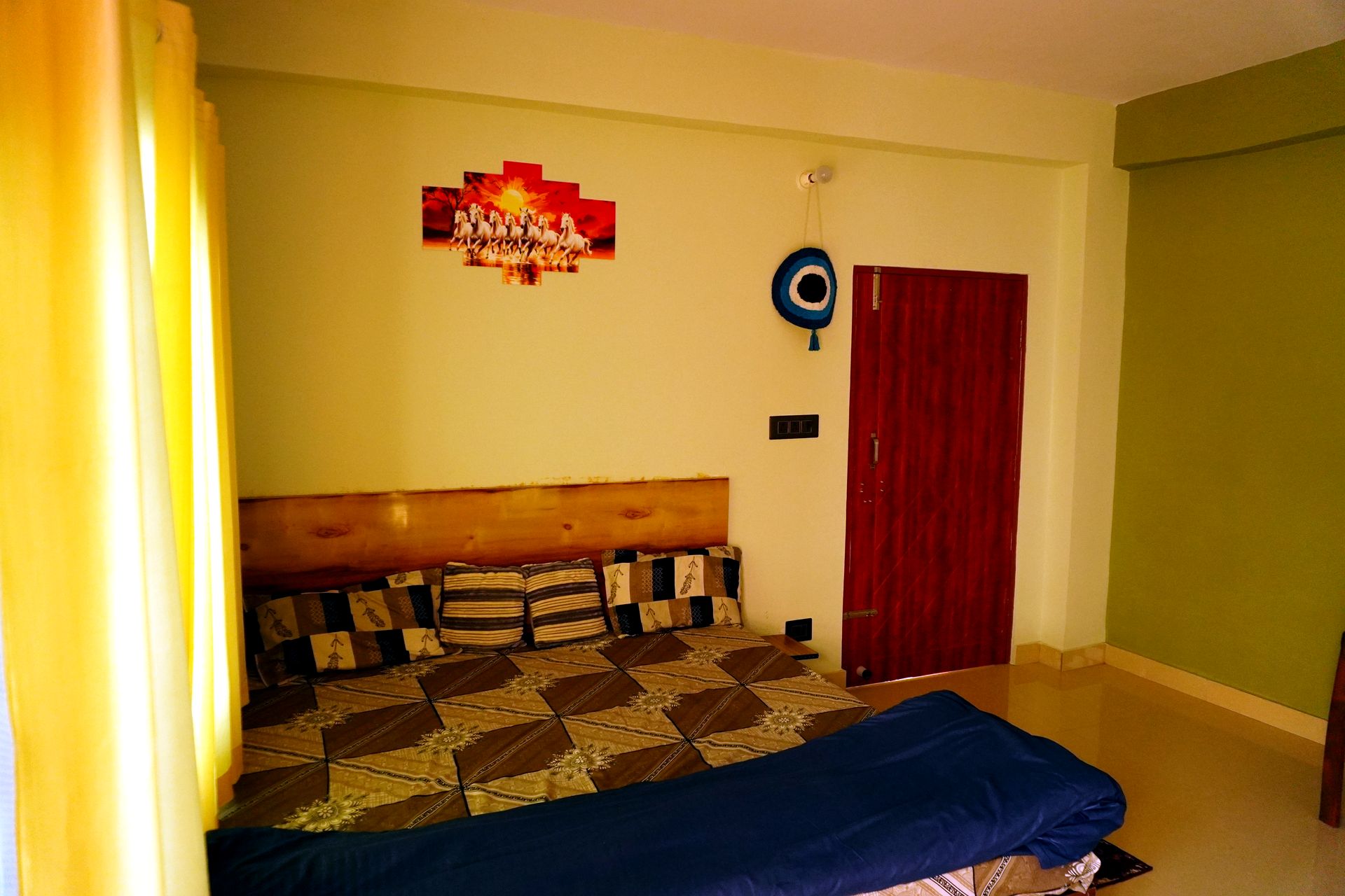 Room with balcony door open to morning light